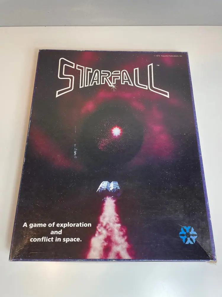 Board game titled "Starfall" with an image of a spaceship and nebulae on the cover, featuring the tagline "A game of exploration and conflict in space."