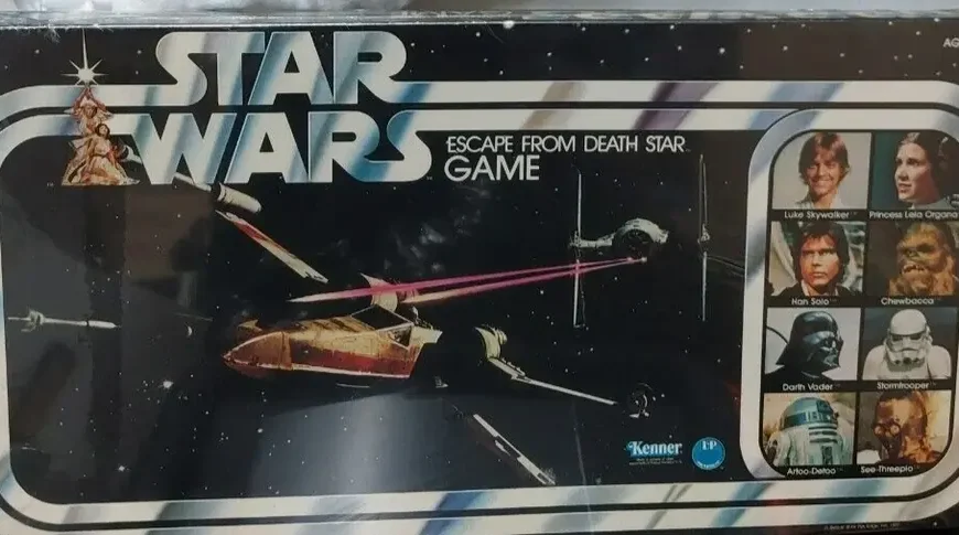 A vintage "Star Wars Escape from Death Star Game" board game box featuring images of X-Wing and TIE Fighters in space, along with headshots of characters Luke Skywalker, Princess Leia, Han Solo, Chewbacca, Darth Vader, and a Stormtrooper. The box also displays the Kenner logo and is marked for ages 7 and up.