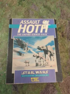 A vintage "Assault on Hoth: The Empire Strikes Back" Star Wars adventure board game by West End Games, showing artwork of AT-AT walkers on the cover.