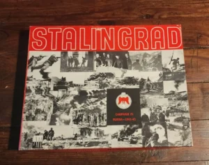 A board game titled "STALINGRAD CAMPAIGN IN RUSSIA - 1941-45" featuring a montage of black and white historical war photos and a red and white color scheme on the cover.