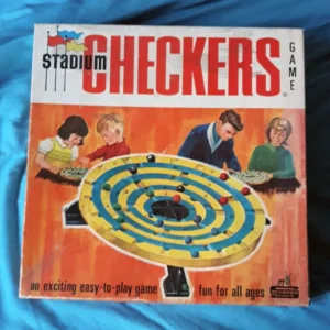 Vintage "Stadium Checkers" board game box featuring illustrations of two children and two adults playing the game; the box advertises the game as exciting, easy-to-play, and fun for all ages.