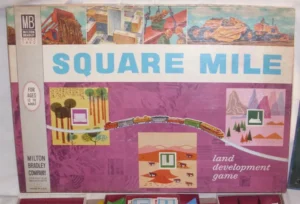 Vintage "SQUARE MILE land development game" board game box cover by the Milton Bradley Company, featuring illustrated scenes of construction, cityscapes, and a train traveling through diverse landscapes, marketed for ages 12 to adult.