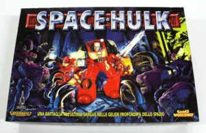 "Space Hulk" board game box cover featuring a space marine in power armor battling purple alien creatures, with various logos and text overlays including the Games Workshop and Warhammer brands.