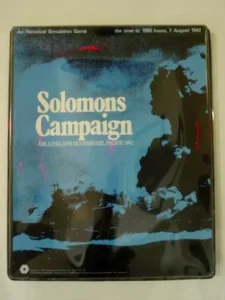 An image of a boxed board game titled "Solomons Campaign," described as an "Historical Simulation Game" set at "the time: 1500 hours, 7 August 1942," themed around air, land, and sea warfare in the Pacific in 1942. The box cover is reflective and partially obscured by glare.