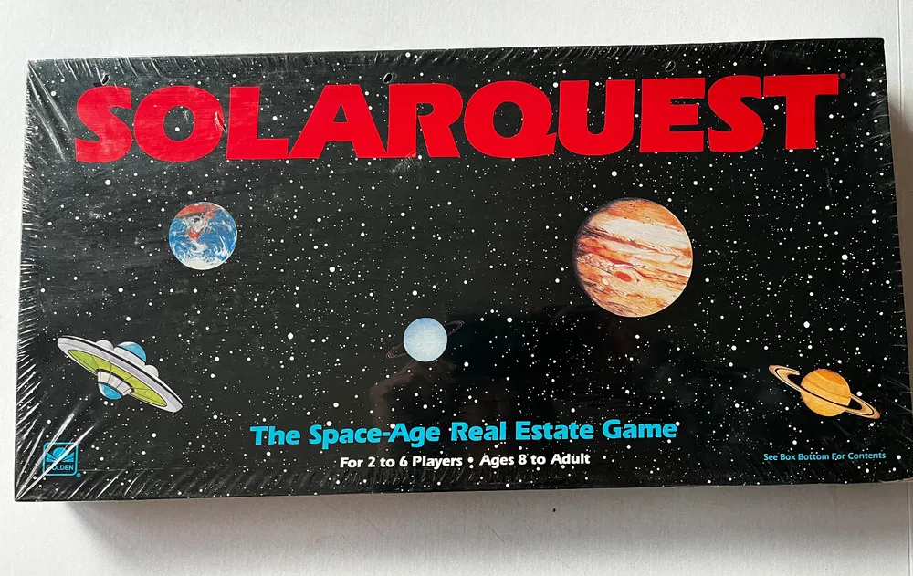 Board game titled "SOLARQUEST: The Space-Age Real Estate Game" for 2 to 6 players, ages 8 to adult, featuring a space-themed design with planets and a spaceship on the cover.