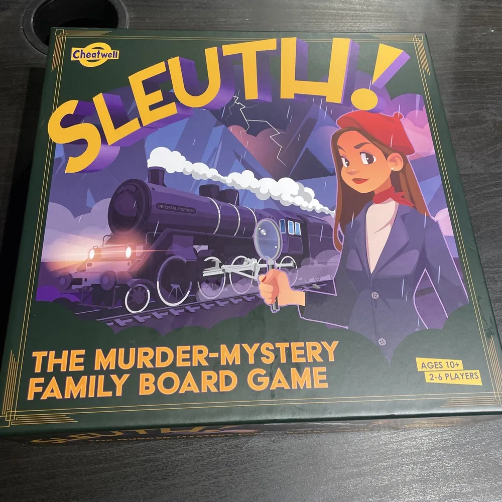 "SLEUTH! The Murder-Mystery Family Board Game box cover, featuring a cartoon-style illustration of a female detective with a magnifying glass, and a steam train in the background, recommended for ages 10+ and 2-6 players."