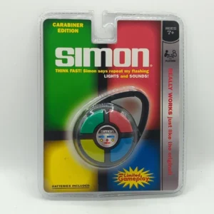 Sealed packaging of a "Simon" electronic game Carabiner Edition with colorful buttons, recommended for ages 7 and up, with the caption "THINK FAST! Simon says repeat my flashing LIGHTS and SOUNDS!" indicating batteries are included and boasting "REALLY WORKS just like the original."
