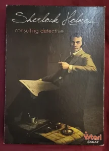 An illustrated game cover portraying Sherlock Holmes as a consulting detective with a pipe in his hand, alongside items such as papers, a magnifying glass, and a cup of tea, with the logo of Ystari Games at the bottom.