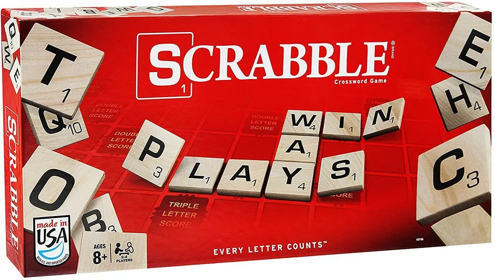 Scrabble Crossword Game box with letter tiles scattered on and around it, emphasizing the game's focus on word formation and letter values.