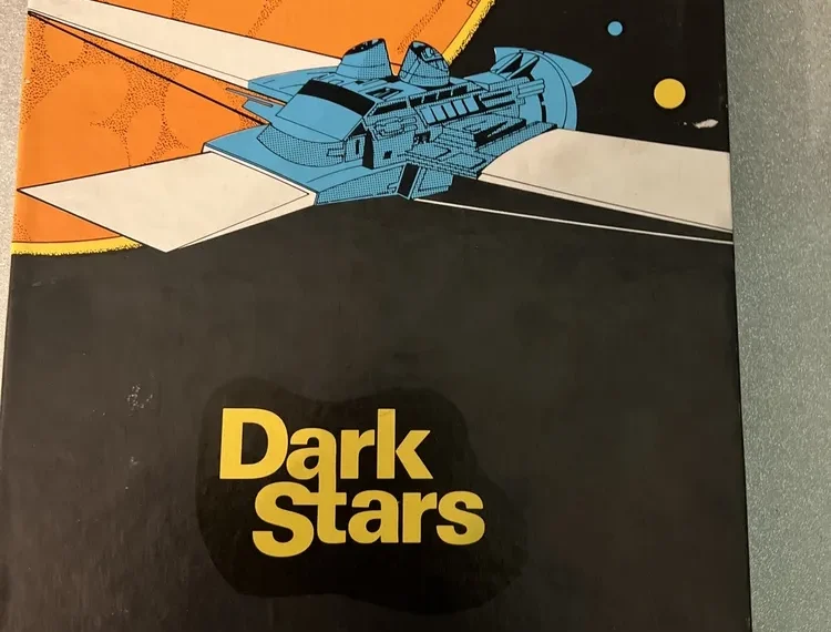 Cover of a "Dark Stars" board game by Simulations Canada, featuring a stylized spaceship against an orange planet and starry space background.