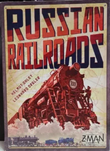 Board game cover for "Russian Railroads" featuring an illustration of a vintage steam locomotive with large "RRR" initials, with game authors' names "Helmut Ohley" and "Leonhard Orgler" at the bottom, and the Z-MAN Games logo.