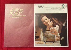 An old board game labeled "Scrabble brand RSVP three dimensional crossword game" alongside a photo of a man and a woman playing the game, with the box showing a price tag of $6.33.