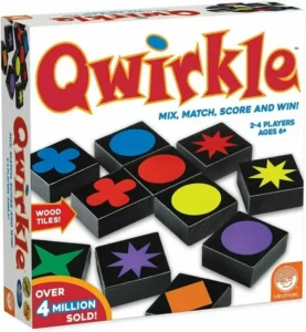 A box of "Qwirkle" board game featuring variously colored wooden tiles with different shapes on them, indicating the game is for ages 6 and up, and suitable for 2-4 players. The box also mentions "OVER 4 MILLION SOLD!" indicating its popularity.