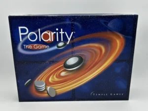 A boxed board game titled "Polarity The Game" with a cosmic-themed illustration featuring planets and a magnetic ring, along with the Temple Games logo.