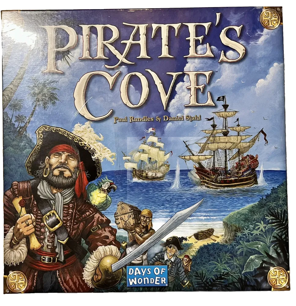 Board game cover titled "Pirate's Cove" with illustrations of a pirate with a sword, a parrot, ships at sea, and the names Paul Randles & Daniel Stahl, published by Days of Wonder.
