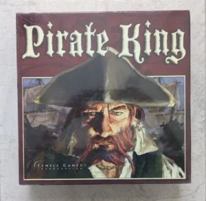 Alt text: A box cover of the board game "Pirate King" by Temple Games, featuring an illustration of a pirate with a tricorn hat and ships in the background.
