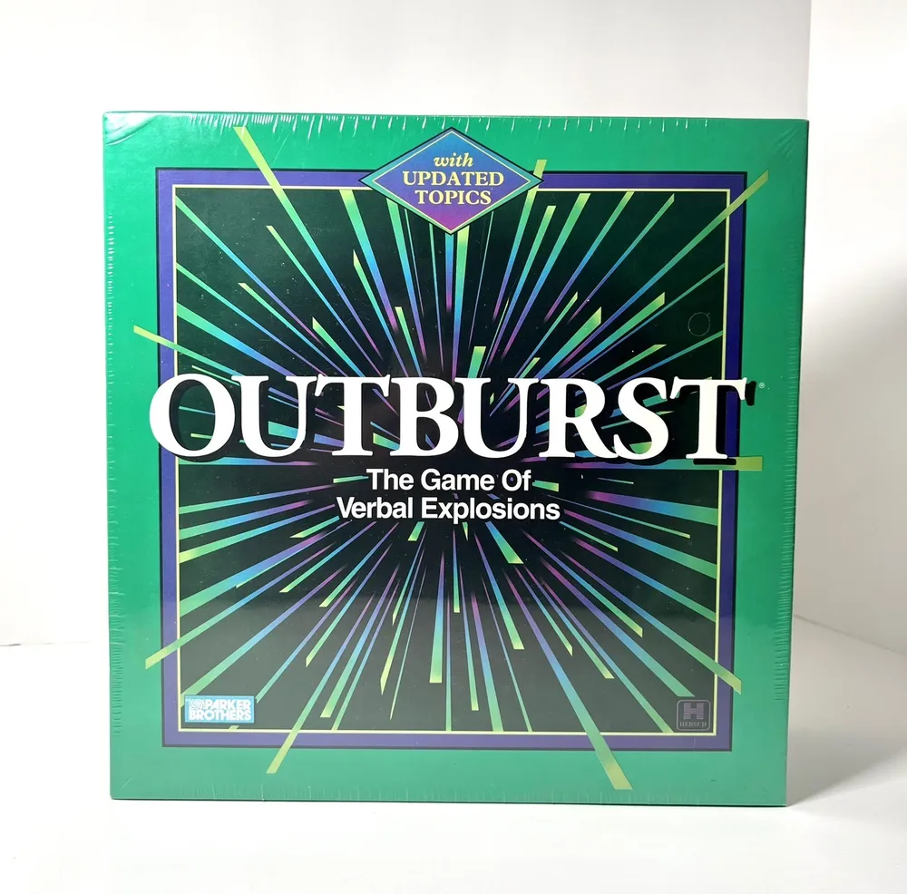Box cover of "OUTBURST - The Game Of Verbal Explosions" with updated topics, by Parker Brothers. The cover features a green background with radiating blue and white lines and large white and purple text.