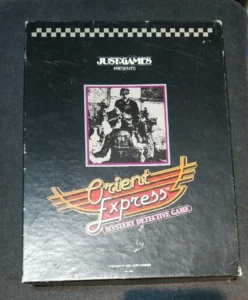 A worn board game box titled "Orient Express, Mystery Detective Game" by Just Games, featuring stylized train imagery and an inset picture of vintage characters.
