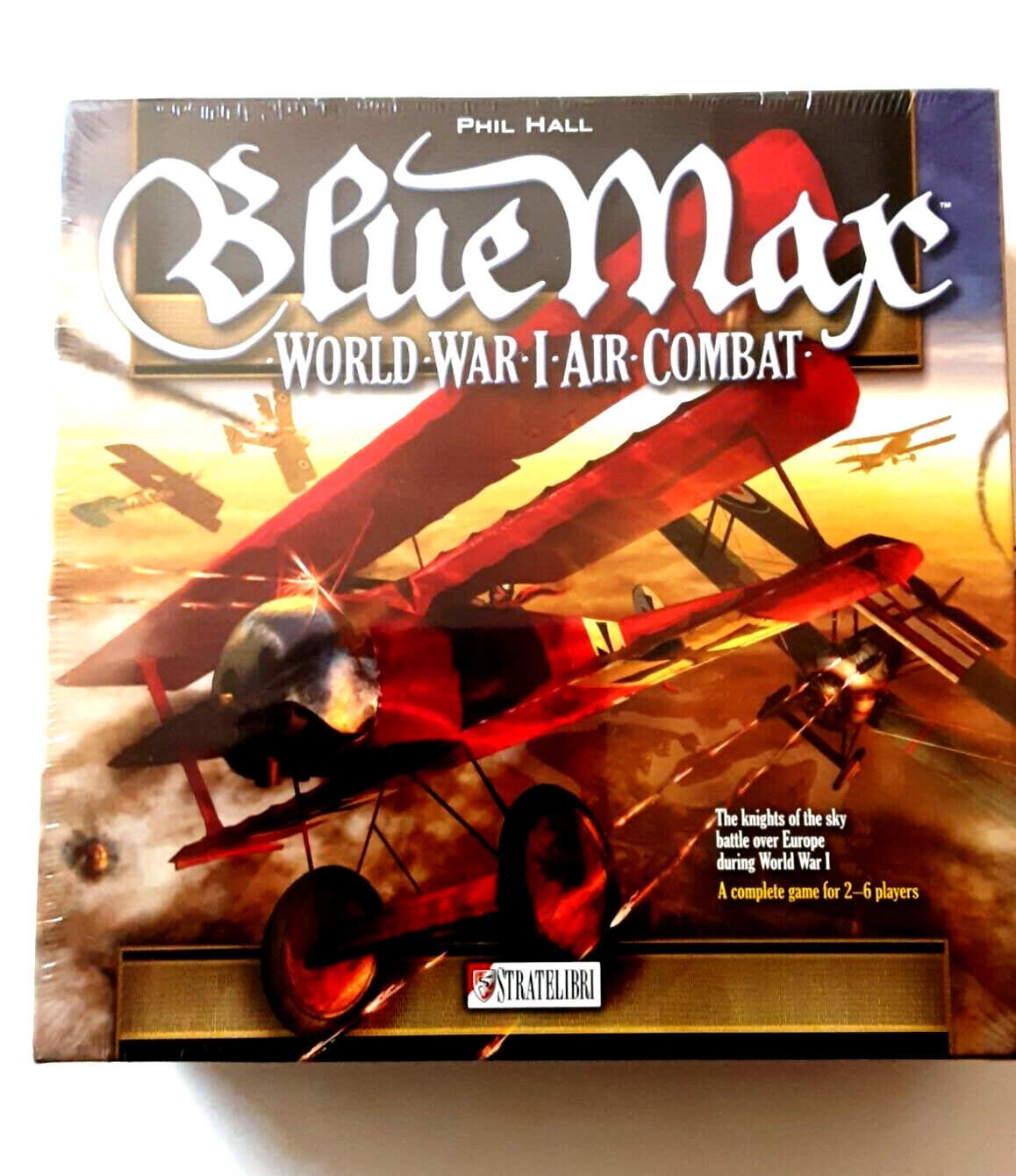 A boxed board game titled "Blue Max: World War I Air Combat" by Phil Hall, depicting World War I biplanes in aerial combat, suitable for 2-6 players.