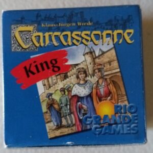 A close-up of the "Carcassonne: King" board game expansion box by Klaus-Jürgen Wrede, showing medieval characters in front of a castle and the Rio Grande Games logo.