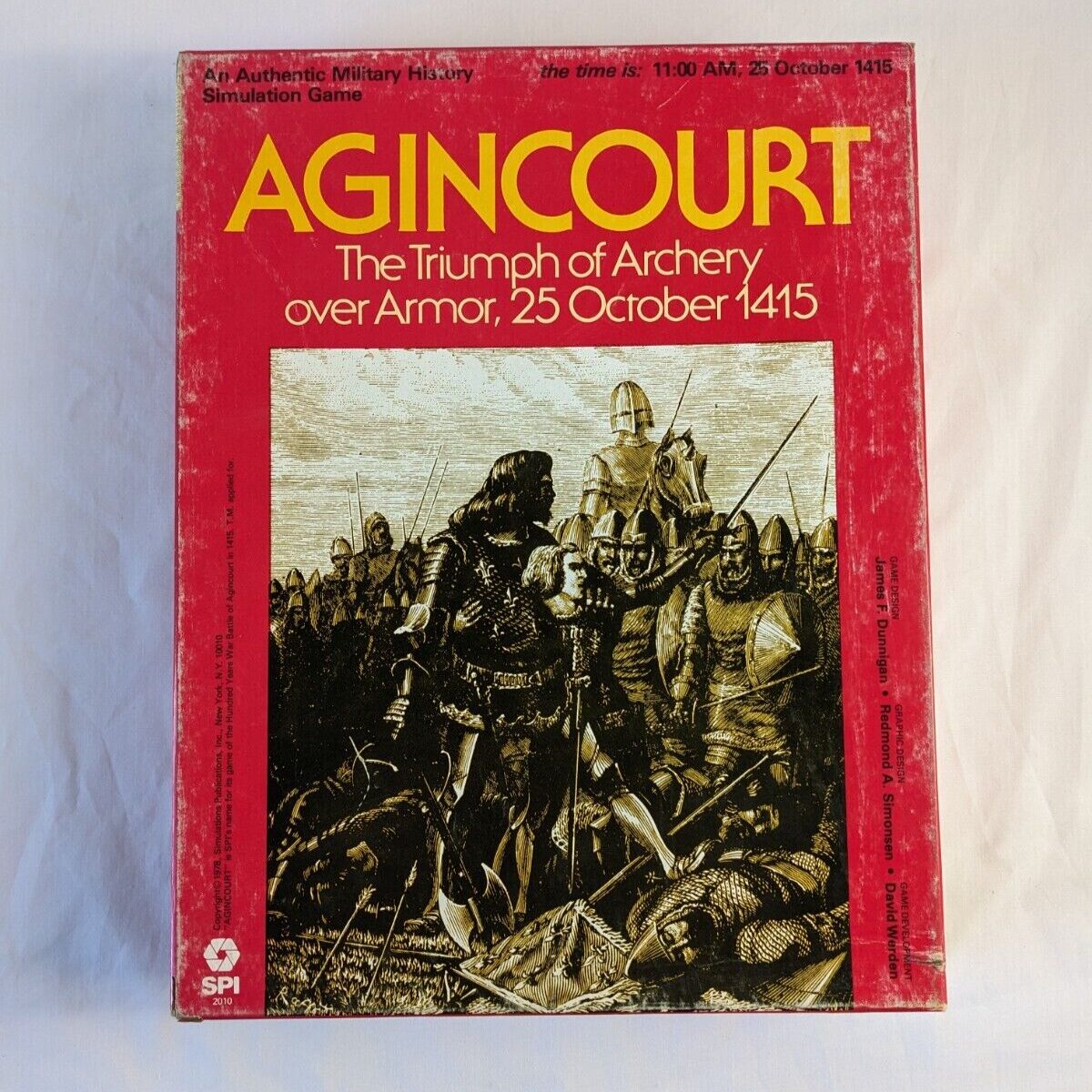 A board game cover titled "AGINCOURT: The Triumph of Archery over Armor, 25 October 1415," featuring an illustration of medieval soldiers in battle.