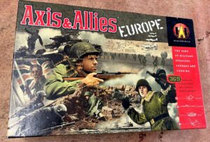 The image shows the board game "Axis & Allies: Europe" by Avalon Hill. The cover art features a collage of World War II themed images including soldiers, tanks, and planes with a map of Europe in the background. There are text elements highlighting the game's focus on military strategy, courage, and cunning, as well as components like historically accurate soldiers, ships, airplanes, weapons, and more.