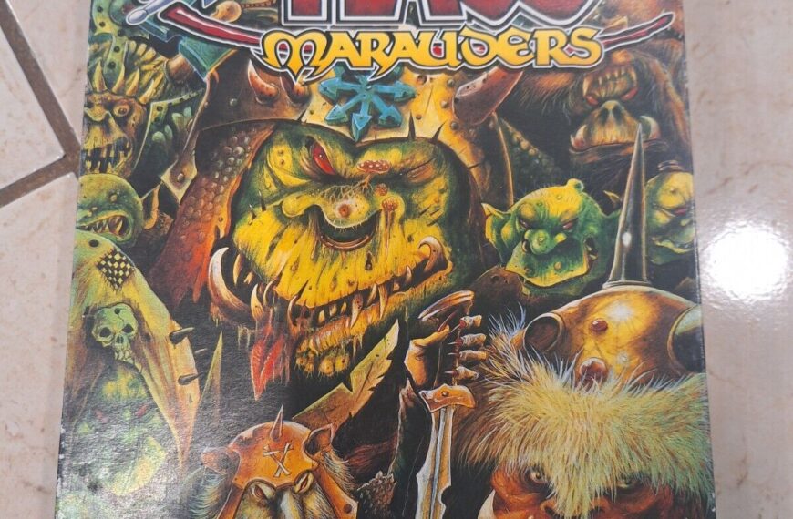 A board game titled "Chaos Marauders" with the tagline "THE MANIC GAME OF ORCISH MAYHEM BY STEPHEN HAND" is lying on a tiled floor. The cover features colorful artwork of cartoonish orc characters and fantasy elements.