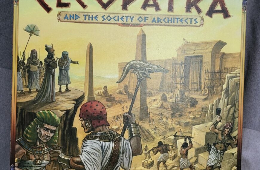 Board game cover for "Cleopatra and the Society of Architects" featuring illustrated ancient Egyptian characters and construction scene with pyramids and pillars in the background.