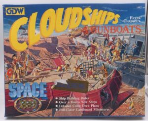 Box cover of the "CLOUDSHIPS & GUNBOATS" game, showing illustrated airships and crew in a battle, with text detailing game features such as ship building rules and cardboard miniatures.