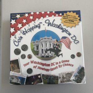 Board game box for "Coin Hopping—Washington DC" featuring images of coins, landmarks, and a cartoon of a man hopping with an American flag, designed for 2-6 players ages 8 to adult.