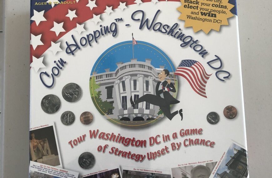 Board game box for "Coin Hopping—Washington DC" featuring images of coins, landmarks, and a cartoon of a man hopping with an American flag, designed for 2-6 players ages 8 to adult.