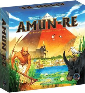 A board game box cover titled "AMUN-RE 20th Anniversary Edition" by Reiner Knizia, illustrated by Vincent Dutrait. The colorful artwork depicts an ancient Egyptian scene with the pyramids in the background, a farmer by the Nile River, a white egret, and an ox in the foreground under a twilight sky.