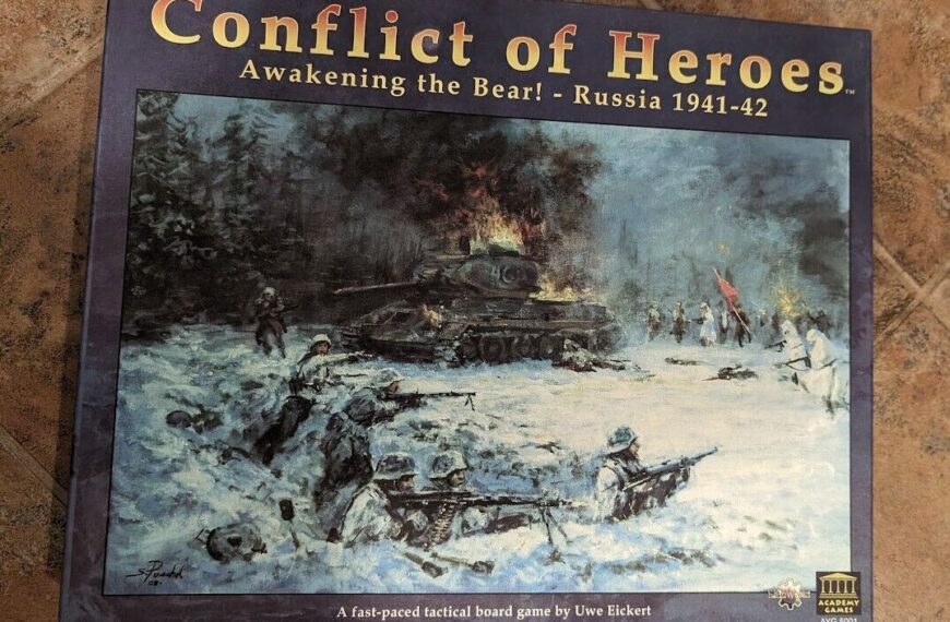 Alt-text: "Box cover for 'Conflict of Heroes: Awakening the Bear! - Russia 1941-42,' depicting a WWII battle scene with soldiers in snow, a burning tank, and trees in the background."