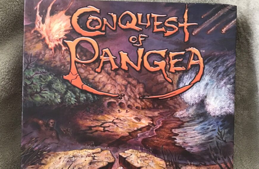 A board game box titled "Conquest of Pangaea" with a prehistoric landscape background and the tagline "Dominate Earth before the Continents Break Apart" displayed on the bottom, placed on a gray textured surface.