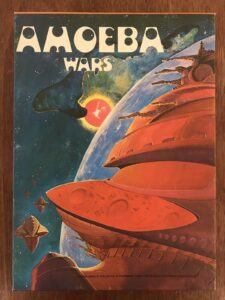 "Cover art of the 'Amoeba Wars' game depicting stylized spaceships in orbit around a colorful planet with stars and a sunrise in the background."