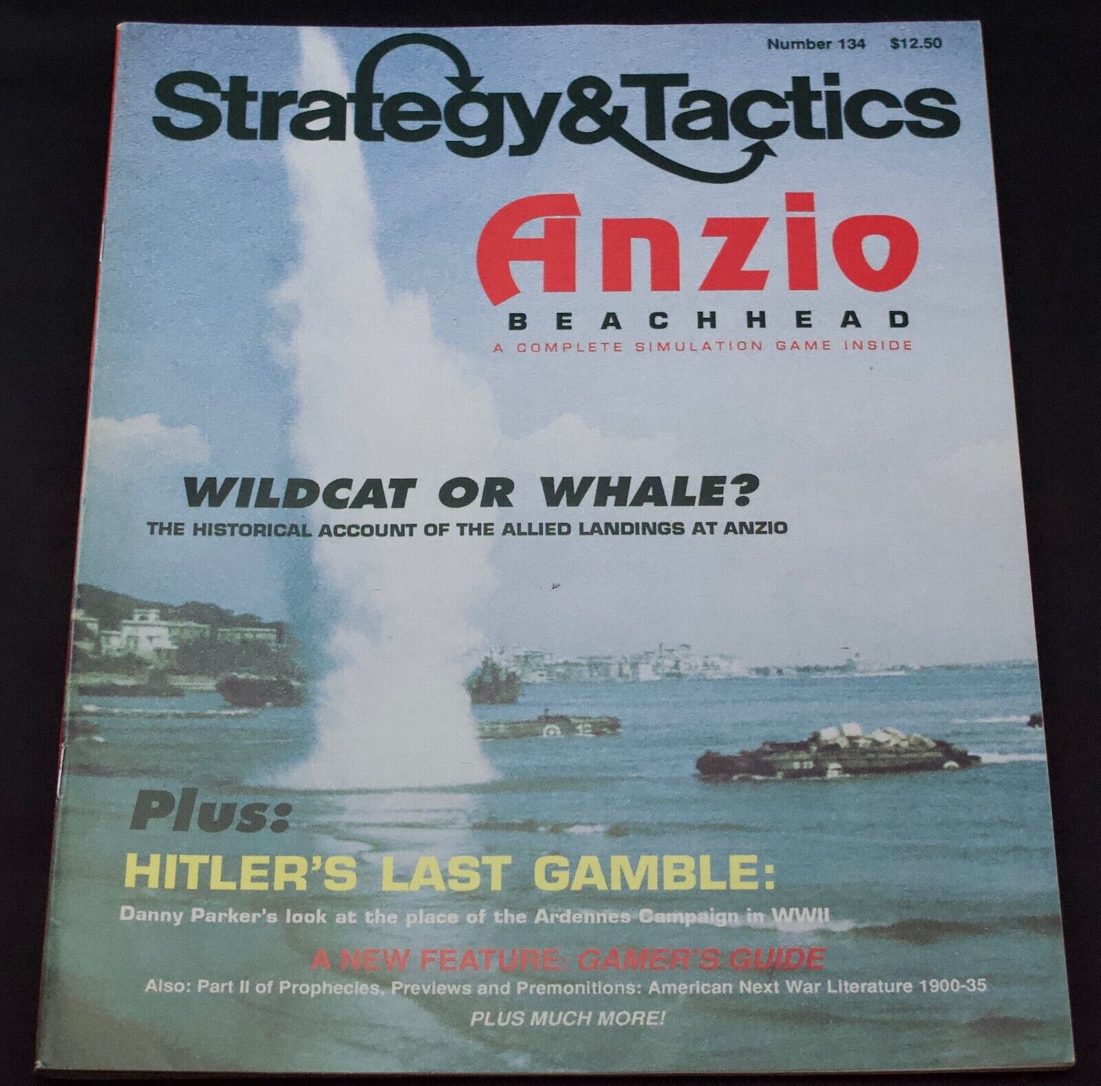 Cover of "Strategy & Tactics" magazine, issue number 134, featuring the title "Anzio Beachhead" with a subtitle "A Complete Simulation Game Inside." The cover shows a historical photo of military landing crafts at sea with smoke rising from naval gunfire. Text on the cover includes "WILDCAT OR WHALE? The historical account of the Allied landings at Anzio", "Hitler's Last Gamble: Danny Parker's look at the place of the Ardennes Campaign in WWII", "A NEW FEATURE: GAMER'S GUIDE" and "Plus much more!" The price is listed as $12.50.