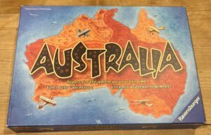 A "Australia" board game box by Ravensburger, illustrated with a stylized map of Australia and vintage airplanes, with text in different languages encouraging to embark on an adventure.