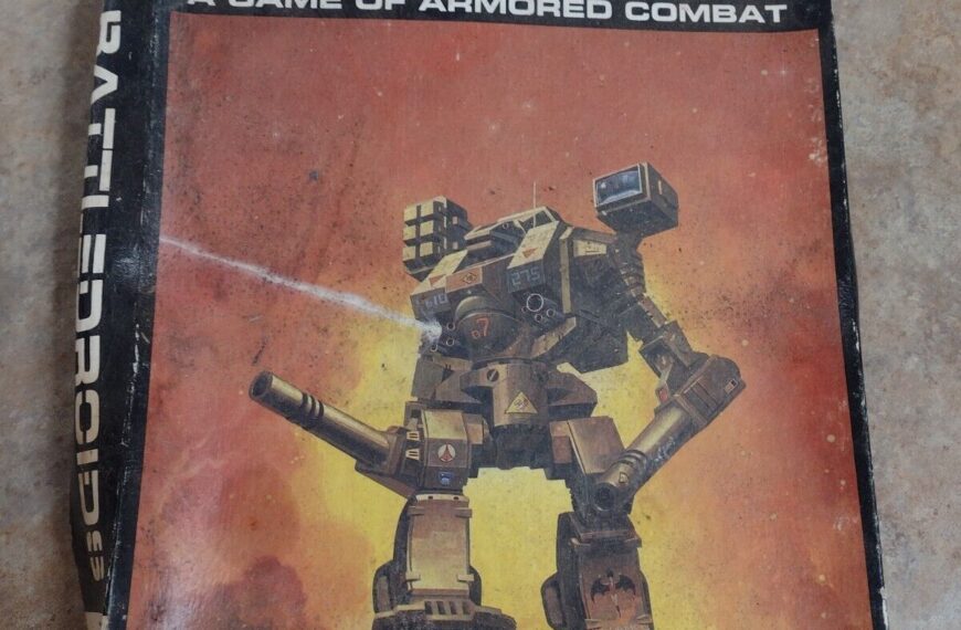 A worn copy of the "BATTLEDROIDS: A GAME OF ARMORED COMBAT" tabletop game box featuring a large robotic mech on a fiery backdrop. The FASA Corporation logo is visible in the bottom right corner.