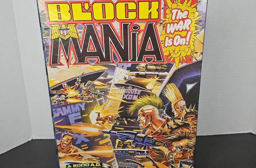 A boxed board game titled "Block Mania" with dynamic and colorful artwork depicting futuristic combat and characters, and text stating, "The WAR is On!" on the cover. The game is associated with the "2000 A.D. Judge Dredd" universe, designed by Richard Halliwell.