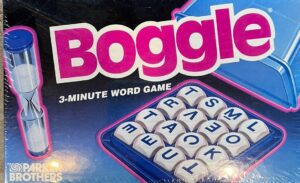 A Boggle board game box, highlighting the game's name in large pink letters and featuring an image of the lettered dice used in play, with the tagline "3-MINUTE WORD GAME" and the Parker Brothers logo visible.