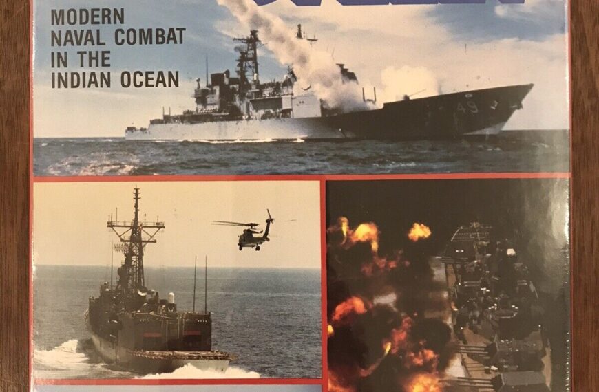 Box cover of "5th Fleet" board game, featuring images of modern naval combat in the Indian Ocean with military ships, a helicopter, and explosions at sea. Text includes the game's title, description, and publisher information (Victory Games Inc.).