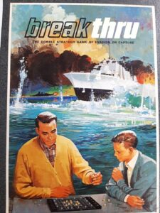 Vintage board game cover art for "breakthru" depicting two men playing a strategy game with a yacht and a scenic coastline in the background.