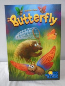 Board game cover titled "Butterfly" by Stephen Glenn, depicting a whimsical scene with an anthropomorphic hedgehog holding a magnifying glass and butterflies with cartoonish faces and large wings, published by Rio Grande Games.