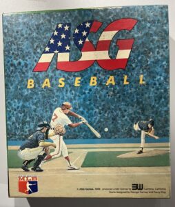 "Vintage ASG Baseball board game cover featuring an illustrated scene of a baseball batter, catcher, and pitcher in action, with a blue speckled background and the ASG logo adorned in the American flag colors at the top; the MLB logo is present at the bottom."