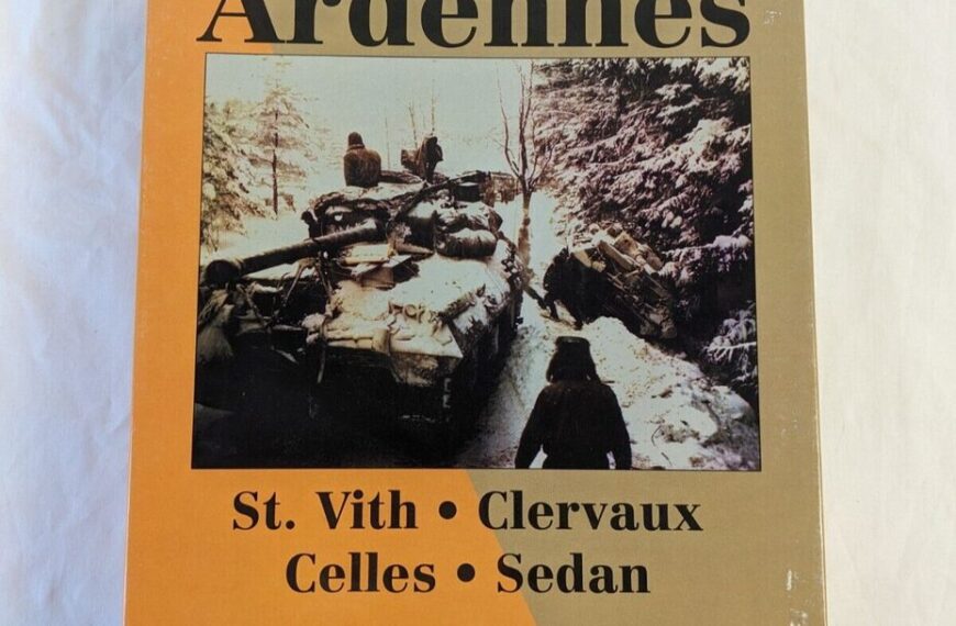 A board game cover titled "Battles for the Ardennes" featuring a historic photo of soldiers on and beside a tank in a snowy forest; locations St. Vith, Clervaux, Celles, Sedan are listed below.