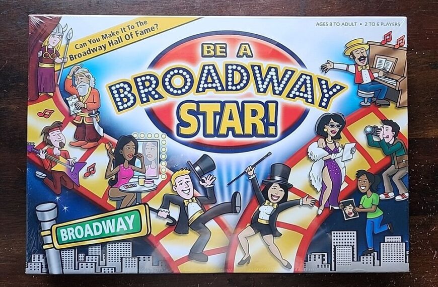 Board game cover for "Be A Broadway Star!" featuring colorful cartoon illustrations of various characters partaking in Broadway-related activities with a large title in the center and a Broadway street sign at the bottom. The cover also includes the text "Can you make it to the Broadway Hall of Fame?" and information about the suitable age range and number of players.