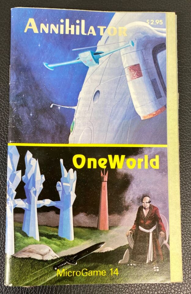 A worn tabletop game booklet titled "Annihilator / OneWorld MicroGame 14" with a price of $2.95. The top half shows a space scene with a blue fighter jet and a part of a large spaceship against a starry sky. The bottom half of the booklet depicts a fantastical landscape with large blue crystals, a red obelisk, a katana sword on the ground, and a person in a long robe standing beside the sword.