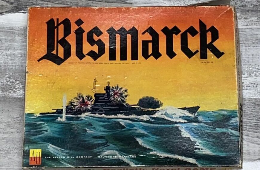 A worn vintage board game box titled "Bismarck" featuring an illustration of a battleship at sea with explosions around it, set against a yellow-to-black gradient background. The Avalon Hill Company logo is at the bottom left.