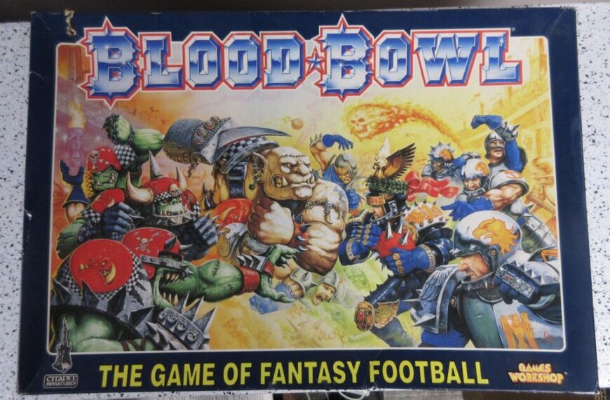 Box art for Blood Bowl, the game of fantasy football, featuring a chaotic illustration of various fantastical creatures and humanoids engaged in a football-like game, with the title in bold red and blue at the top.