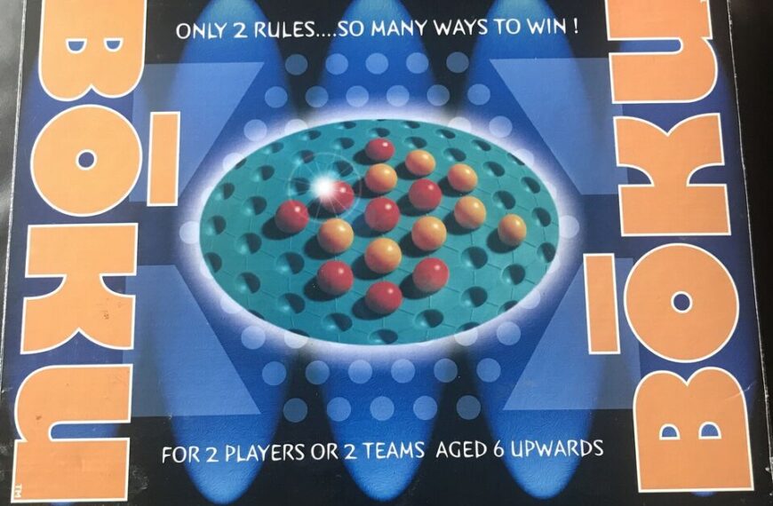 An image of the board game "BOKU" packaging with the text "ONLY 2 RULES...SO MANY WAYS TO WIN!" and "FOR 2 PLAYERS OR 2 TEAMS AGED 6 UPWARDS" displayed around a central image of a board with colorful pegs inserted into holes.